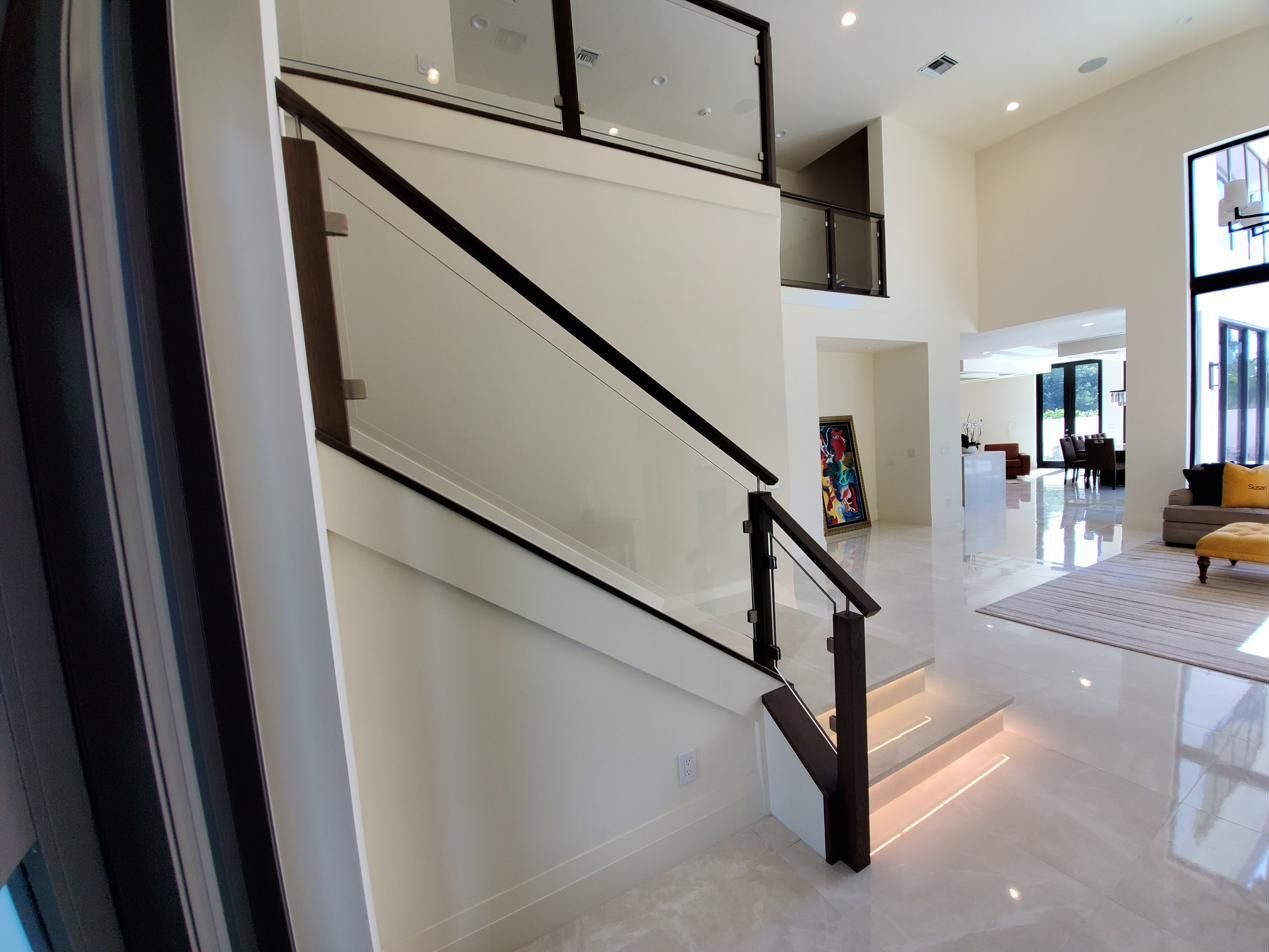 Glass railing along an entry staircase