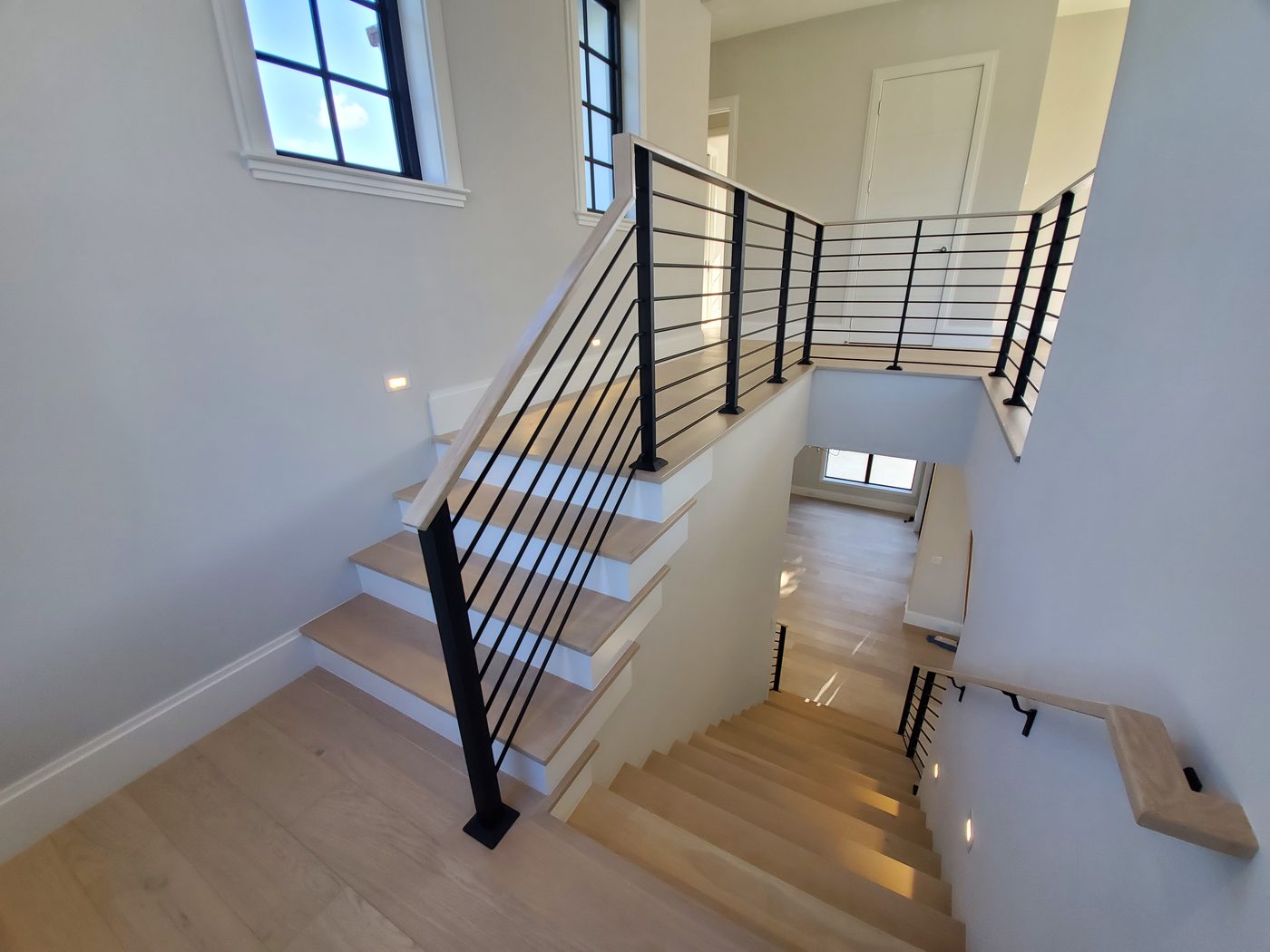 Switchback staircase with horizontal rod railing