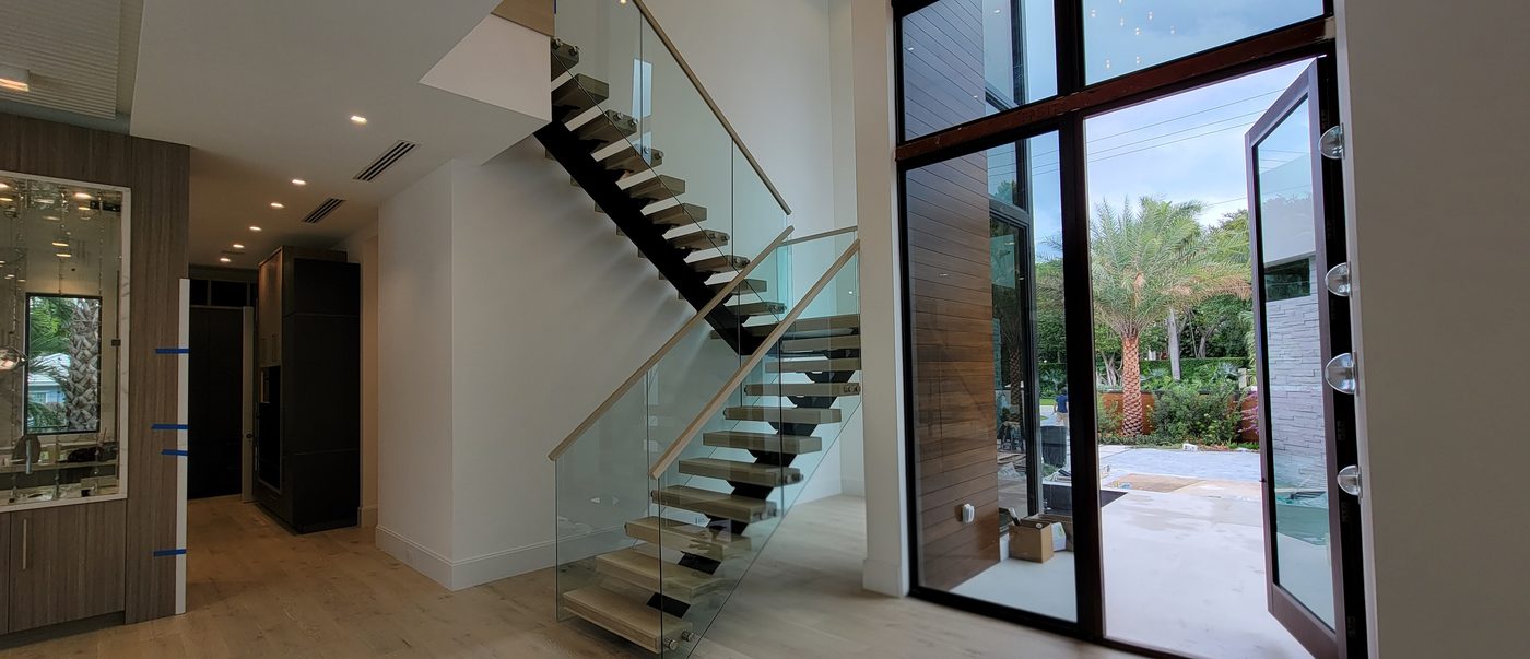 Floating staircase with glass railing