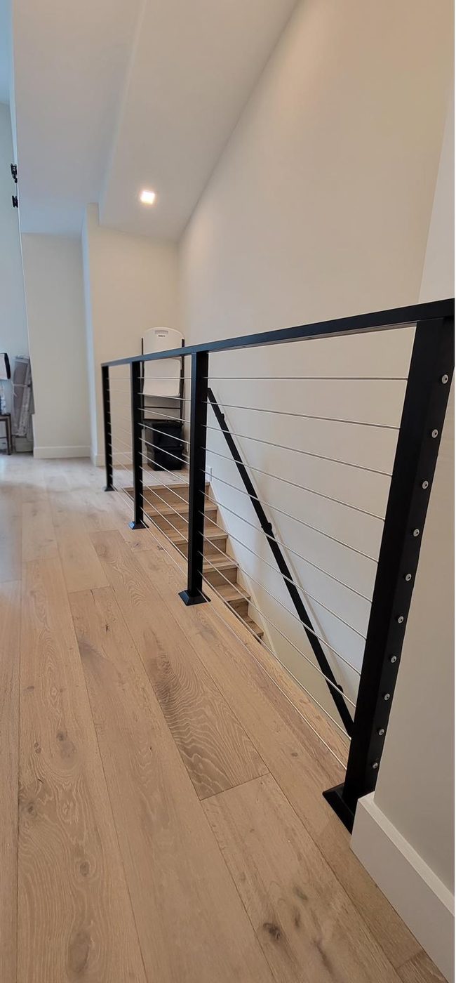 Cable railing along a floating staircase