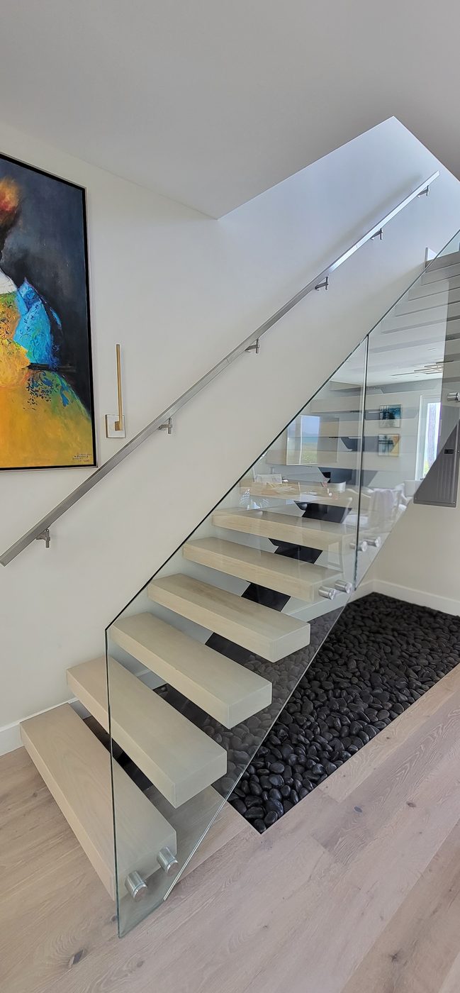 Floating staircase with standoff glass railing