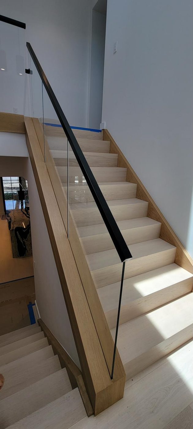 Staircase with frameless glass railing
