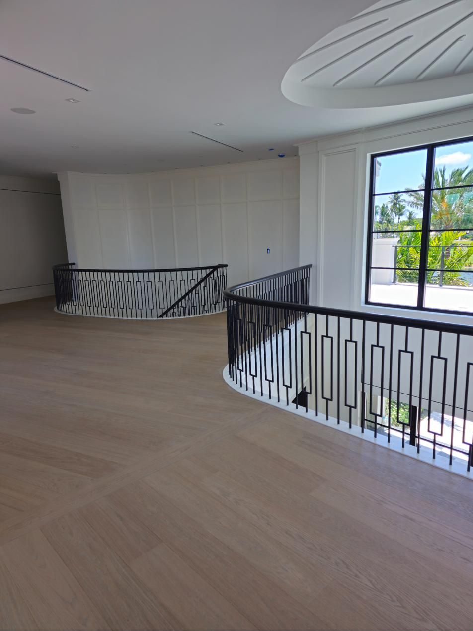 Curved balcony railing with ornamental ironwork