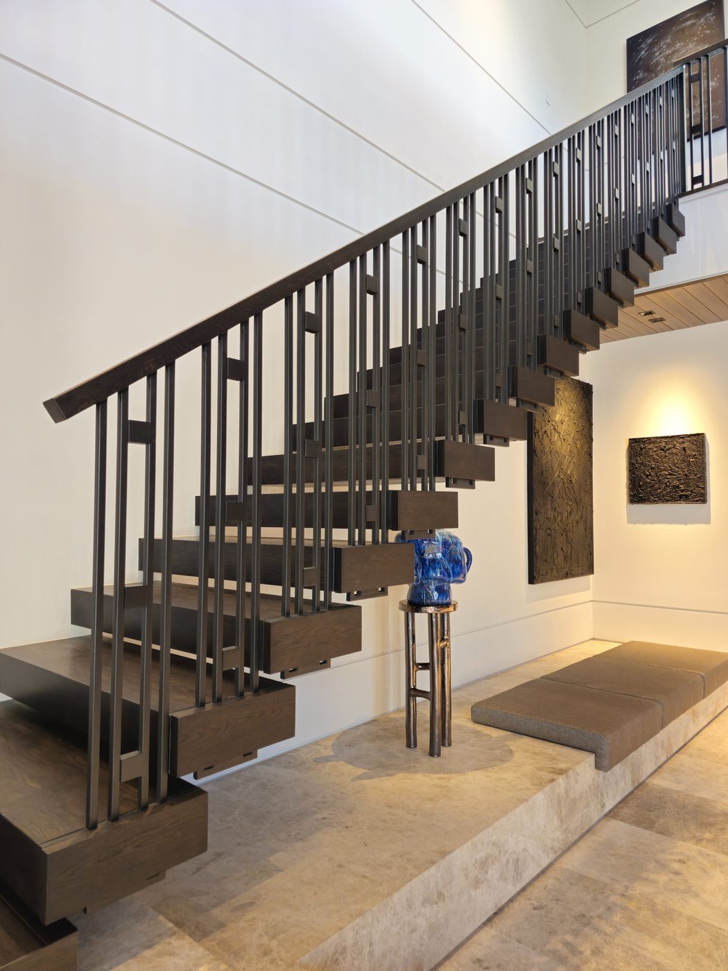 Floating staircase with vertical metal rod railing