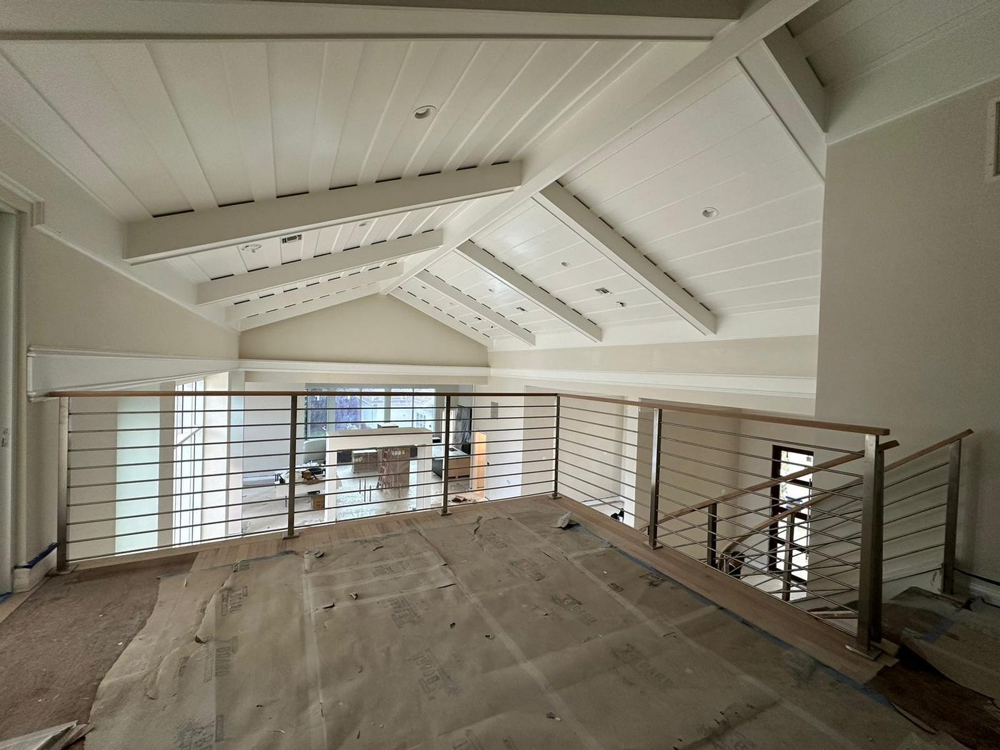 Mezzanine with horizontal stainless bar railing
