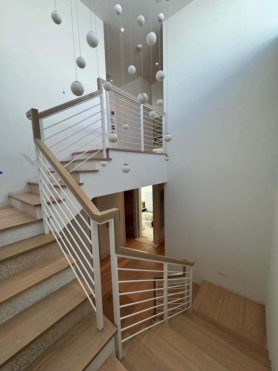 Switchback staircase with metal rod railing