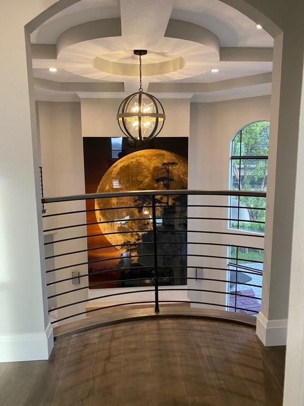 Curved metal rod railing on a balcony landing