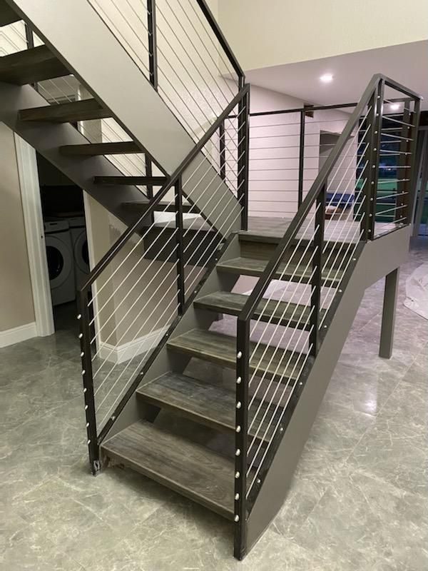 Steel staircase with cable railing
